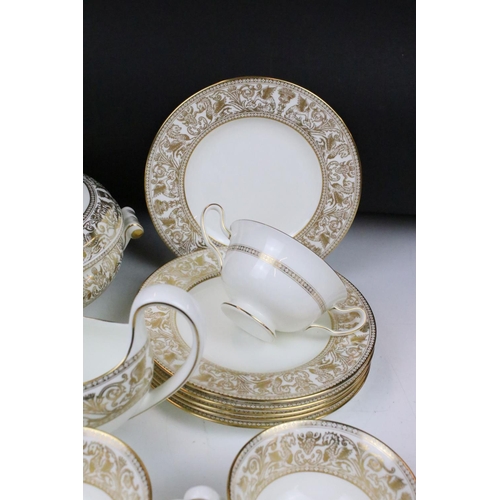 117 - Wedgwood 'Gold Florentine' part dinner service for 6 (pattern no. W4219), to include 2 tureens & cov... 