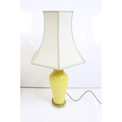 118 - Pair of Chinese-style yellow glazed table lamps of baluster form, with shades. Measure approx 70cm h... 