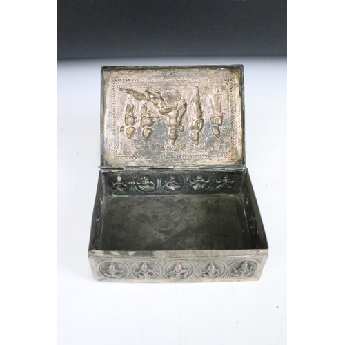 299 - Two ornate white metal lidded boxes with repouse decoration together with a small white metal cauldr... 