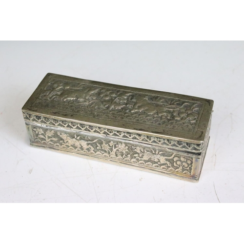 299 - Two ornate white metal lidded boxes with repouse decoration together with a small white metal cauldr... 