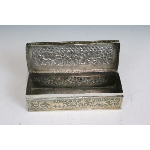 299 - Two ornate white metal lidded boxes with repouse decoration together with a small white metal cauldr... 