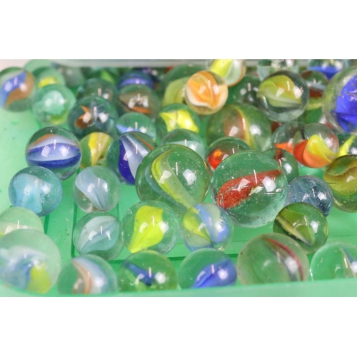 303 - A mixed collection of marbles to include various sizes and colours.