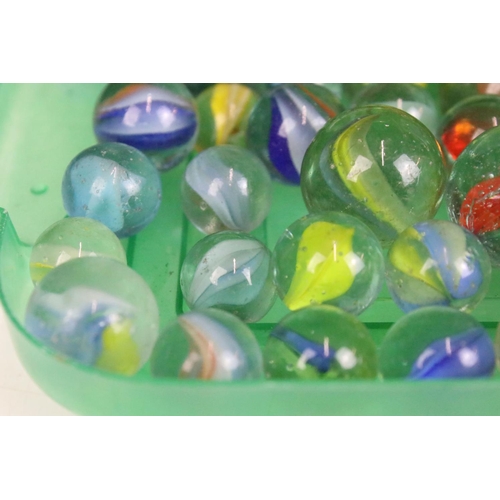 303 - A mixed collection of marbles to include various sizes and colours.