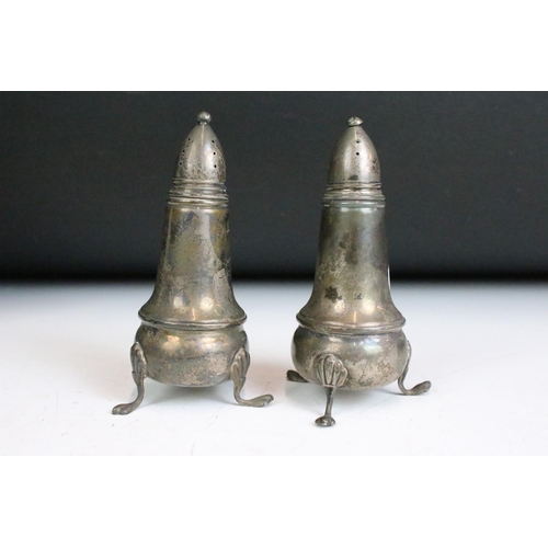 304 - A pair of fully hallmarked sterling silver brushes within fitted display case together with a pair o... 