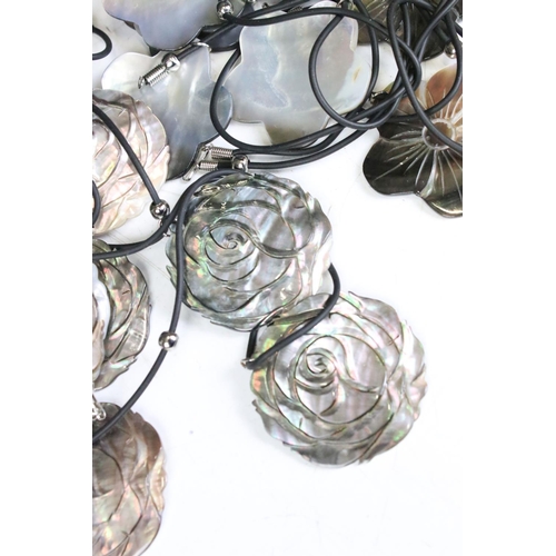 310 - Collection of mother of pearl daisy pendants on leather strings and Collection of Mother of Pearl Lo... 