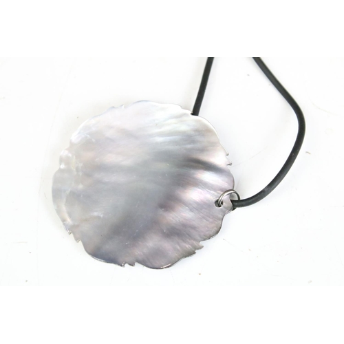 310 - Collection of mother of pearl daisy pendants on leather strings and Collection of Mother of Pearl Lo... 