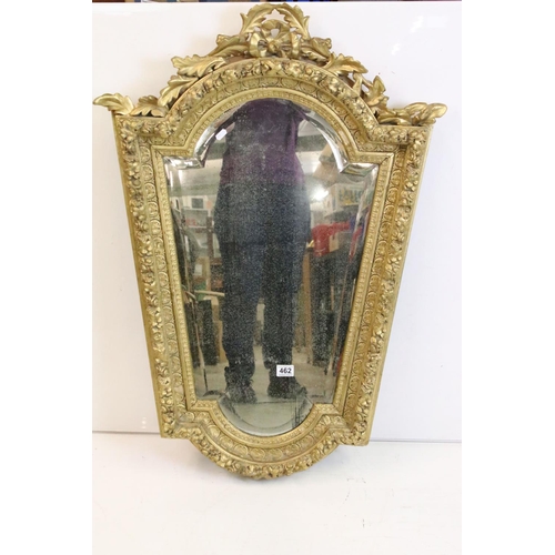 462 - 19th century Italian style shaped Wall Mirror held with a Floral Carved Giltwood and Gesso Frame, 10... 