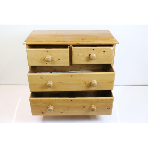 520 - Victorian Pine Chest of Two Short over two long drawers, with turned knob handles and raised on brac... 