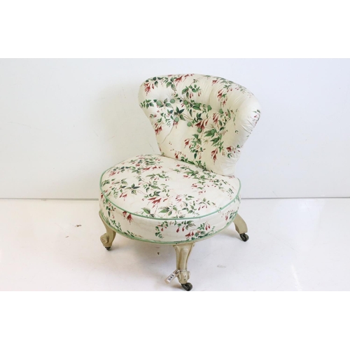 543 - Late 19th / Early 20th century Low Bedroom Chair, the button back and circular seat with ivory groun... 