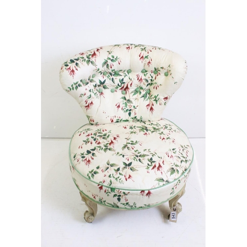 543 - Late 19th / Early 20th century Low Bedroom Chair, the button back and circular seat with ivory groun... 