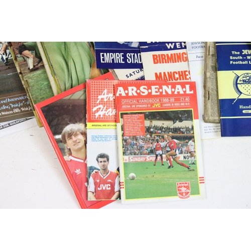 604 - Football memorabilia boxes, comprises of sticker albums, coin collections, assorted handbook, annual... 