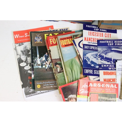 604 - Football memorabilia boxes, comprises of sticker albums, coin collections, assorted handbook, annual... 