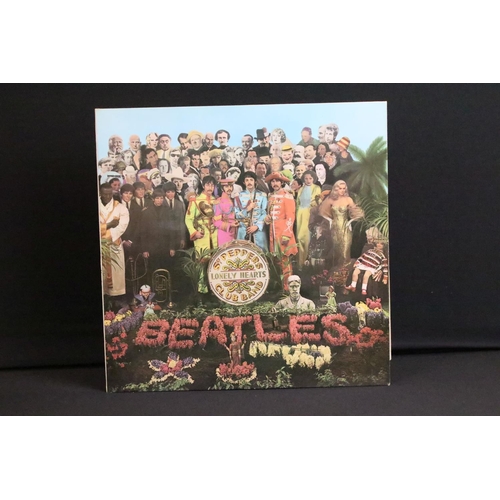 388 - Vinyl - 2 stereo copies of The Beatles Sgt Pepper (PCS 7027).  The Gramophone Co Ltd and Sold In The... 