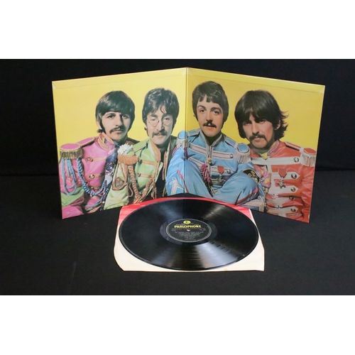 388 - Vinyl - 2 stereo copies of The Beatles Sgt Pepper (PCS 7027).  The Gramophone Co Ltd and Sold In The... 