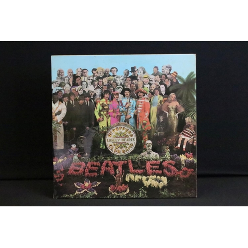 388 - Vinyl - 2 stereo copies of The Beatles Sgt Pepper (PCS 7027).  The Gramophone Co Ltd and Sold In The... 