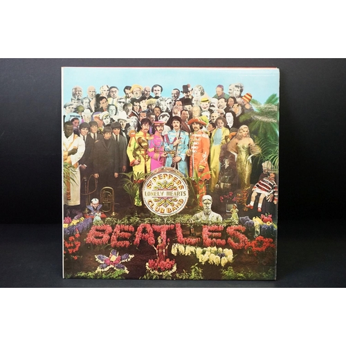 352 - Vinyl - 2 stereo copies of The Beatles Sgt Pepper (PCS 7027).  Two boxed EMI black & silver label re... 