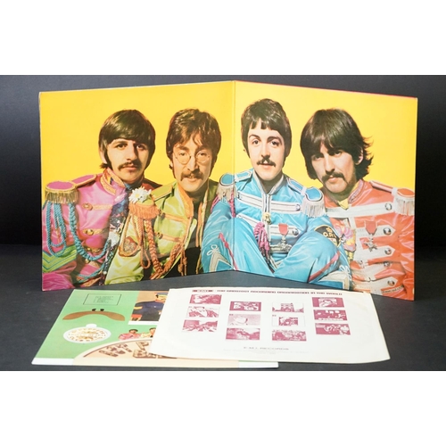 352 - Vinyl - 2 stereo copies of The Beatles Sgt Pepper (PCS 7027).  Two boxed EMI black & silver label re... 