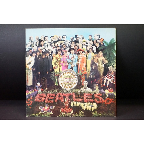 352 - Vinyl - 2 stereo copies of The Beatles Sgt Pepper (PCS 7027).  Two boxed EMI black & silver label re... 