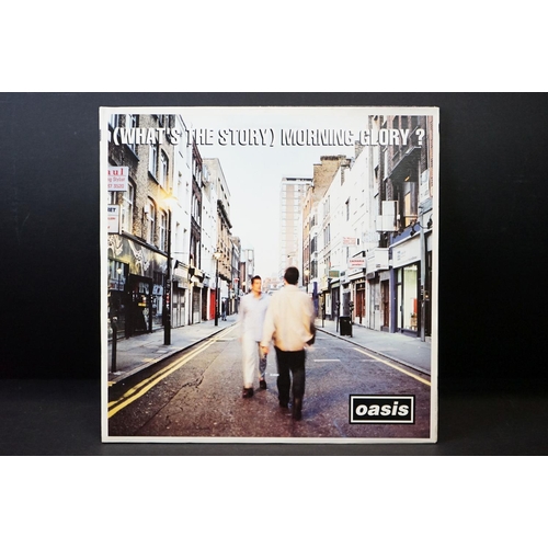 543 - Vinyl - 2 Original pressing Oasis LPs to include Definitely Maybe (CRELP169) Vg, and What's The Stor... 