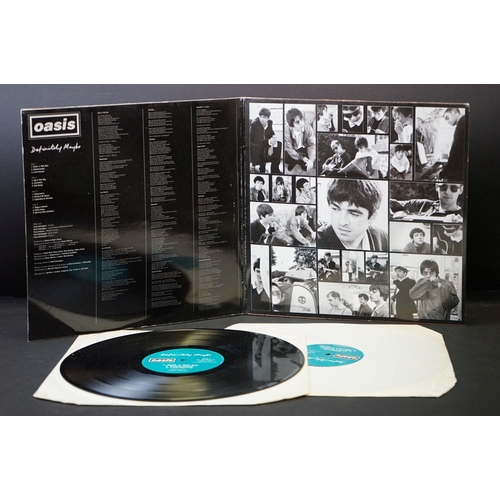 543 - Vinyl - 2 Original pressing Oasis LPs to include Definitely Maybe (CRELP169) Vg, and What's The Stor... 