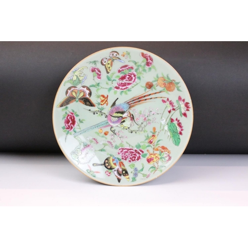 15 - 19th Century Chinese famille rose plate being hand decorated with birds of paradise to the centre su... 