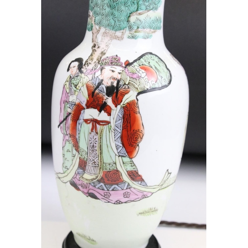 23 - Chinese famille verte lamp base featuring immortals in a landscape scene with hand applied colours a... 