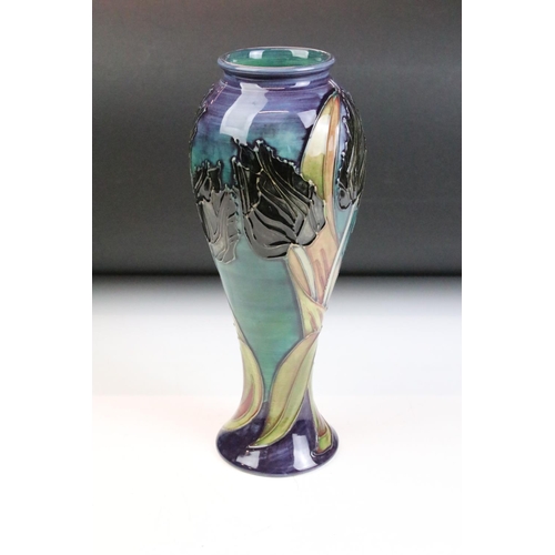 8 - 20th Century Moorcroft baluster vase in the black tulip pattern having tube lined floral decoration.... 