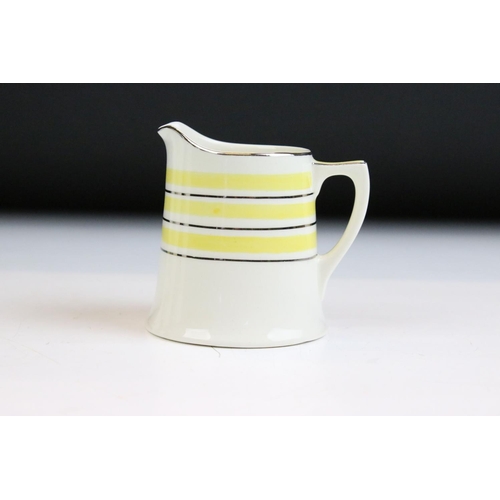 30 - Art Deco Crown Ducal coffee set having a yellow striped design with silver gilt details. To include ... 