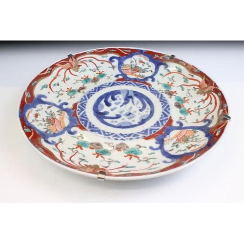 36 - Group of three Oriental ceramic plates. The lot to include a Chinese Canton famille rose plate, a Ja... 