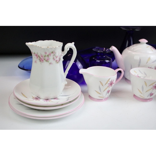 49 - Assorted ceramics to include Shelley pink floral tea set for two, Bristol blue glass, early Royal Do... 