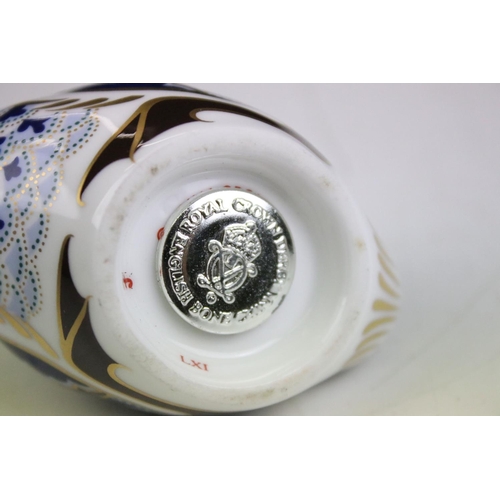 55 - Group of three Royal Crown Derby ceramic paperweights to include two birds with gold stoppers and on... 