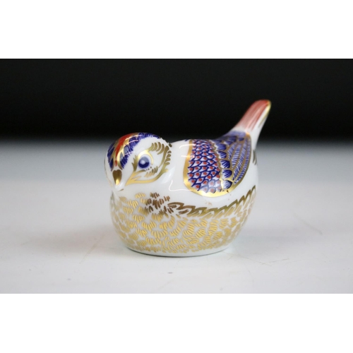 55 - Group of three Royal Crown Derby ceramic paperweights to include two birds with gold stoppers and on... 