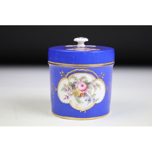 57 - Two porcelian dressing table pots, each having a blue ground with hand painted floral panels. Unmark... 