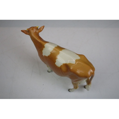 64 - Group of Beswick ceramic animal figurines. The lot to include a pig, ram, two sheep and two cows. Co... 