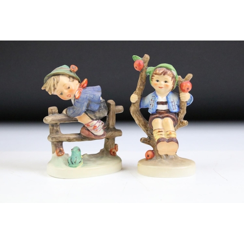 66 - Fourteen Hummel Goebel figurines to include a postman, boy with lamb, flute player etc. Tallest meas... 