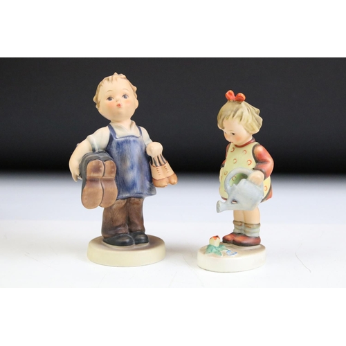 66 - Fourteen Hummel Goebel figurines to include a postman, boy with lamb, flute player etc. Tallest meas... 