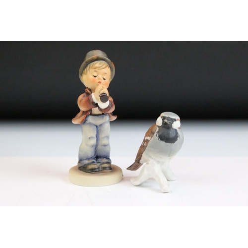 66 - Fourteen Hummel Goebel figurines to include a postman, boy with lamb, flute player etc. Tallest meas... 