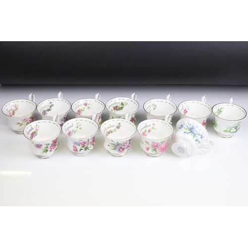 83 - Set of twelve Royal Albert Flower of the Month tea cups and saucers. Each marked to the bases.