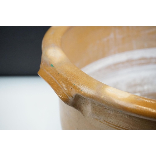 116 - Large 19th Century Victorian salt glazed Dairy Bowl of oval form with twin handles. Measures 23 x 54... 