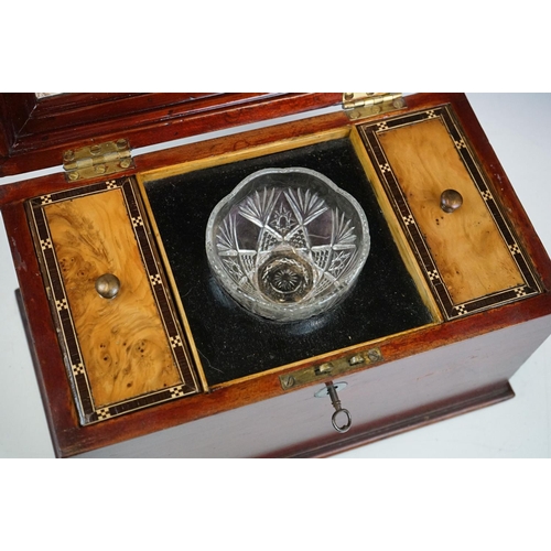 122 - Tea caddy having a hinged lid with inlaid walnut panel opening to reveal tea bowl to the centre flan... 