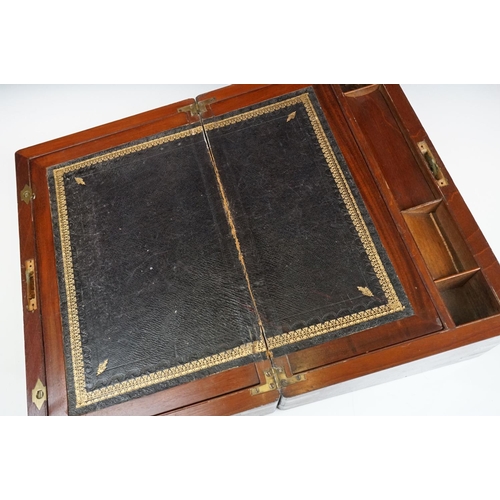 123 - 19th Century Victorian mahogany writing slope having brass banded detailing and a tooled blue leathe... 