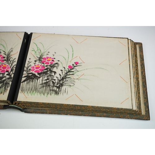 125 - Early 20th Century Japanese lacquer photograph / postcard album featuring a gilt landscape scene to ... 