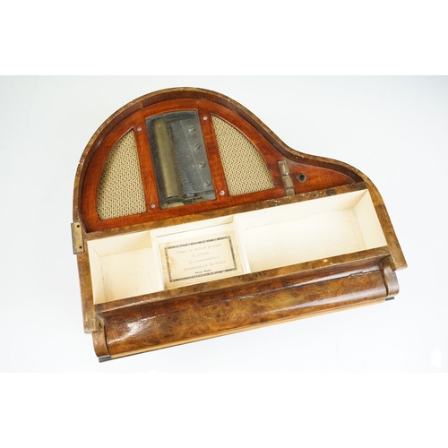 164 - Mid Century walnut music box in the form of a piano. The box having compartment to the front with pa... 