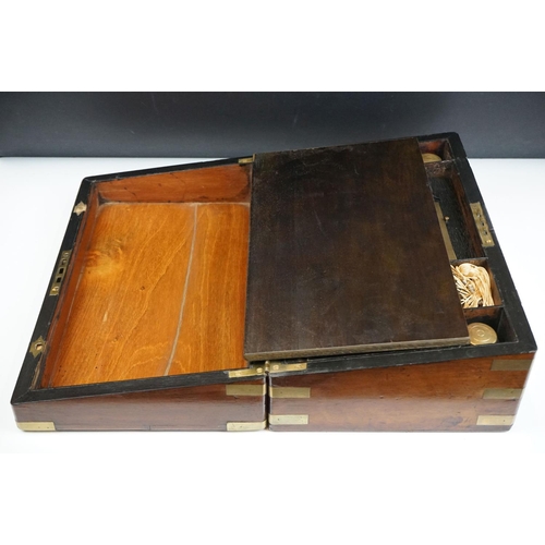 165 - 19th Century mahogany writing slope having brass banding to the exterior opening to reveal a black t... 