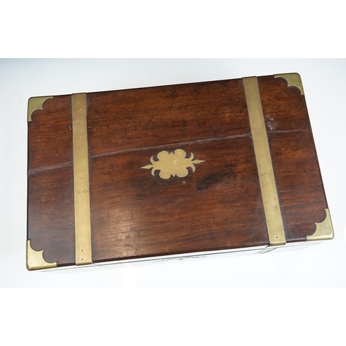 165 - 19th Century mahogany writing slope having brass banding to the exterior opening to reveal a black t... 