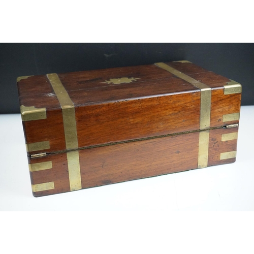 165 - 19th Century mahogany writing slope having brass banding to the exterior opening to reveal a black t... 