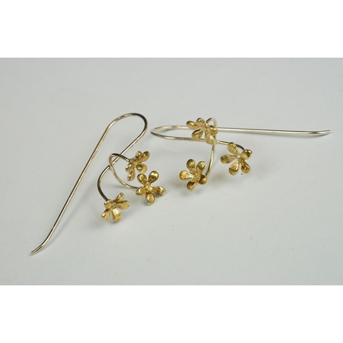 212 - A collection of three pairs of 925 sterling silver earrings to include gilt poppy examples.