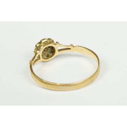 216 - A fully hallmarked 9ct gold band buckle ring together with a ladies 18ct gold dress ring.