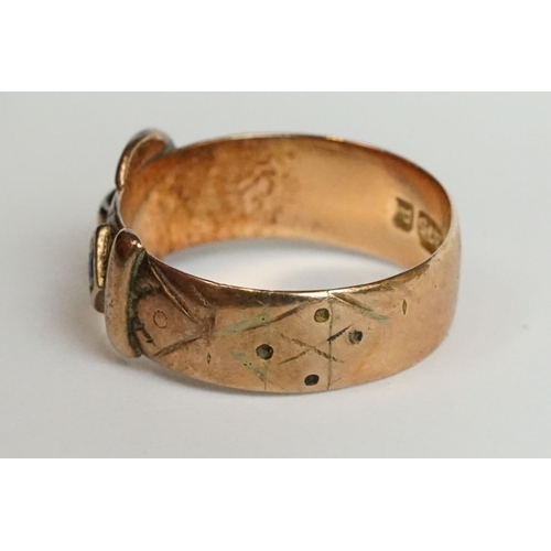 216 - A fully hallmarked 9ct gold band buckle ring together with a ladies 18ct gold dress ring.