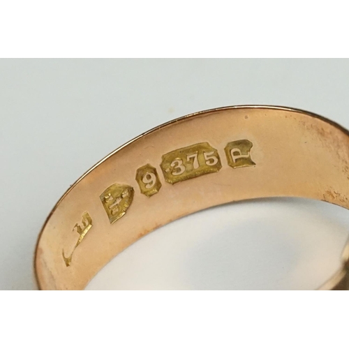 216 - A fully hallmarked 9ct gold band buckle ring together with a ladies 18ct gold dress ring.